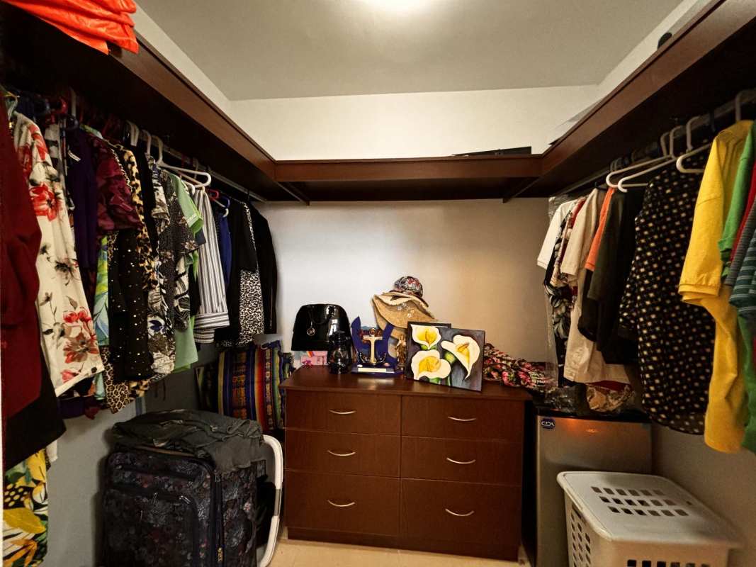 Spacious clubhouse with large windows, event space, and garden views at PH Augusta Brisas del Golf