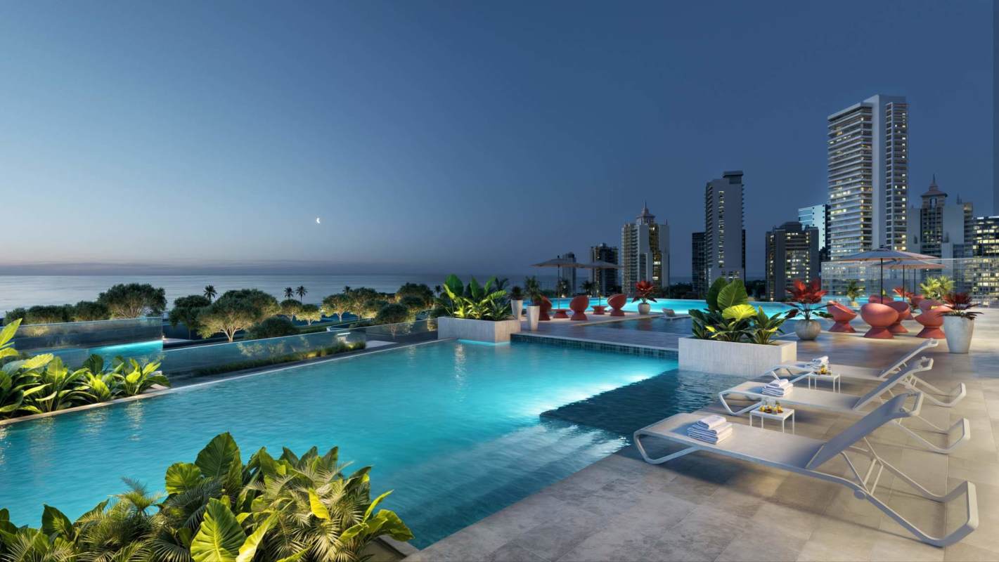 Rooftop infinity pool with lush landscaping and skyline at Aqua Costanera Panama City