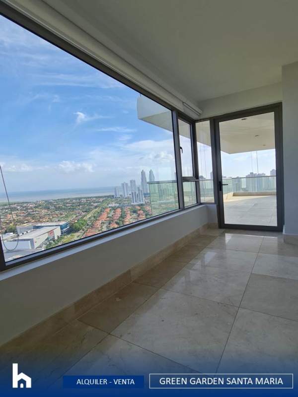 Bright living room with floor-to-ceiling windows and balcony access, golf course views PH Green Garden Santa Maria Panama