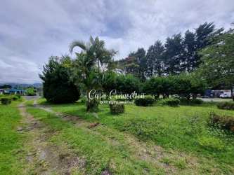 View of highway frontage of commercial lot for sale at busy Volcán intersection in Panama