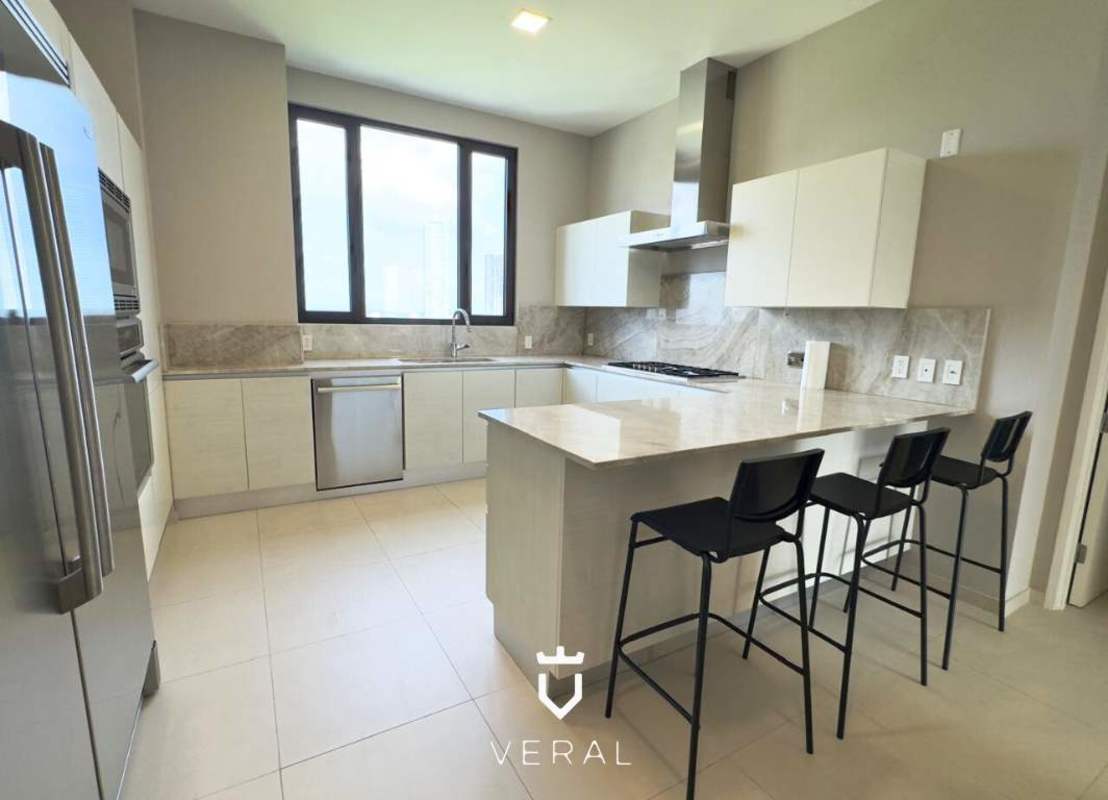 Modern kitchen with marble island, stainless appliances, large windows PH Santa Maria Court Santa Maria Panama City