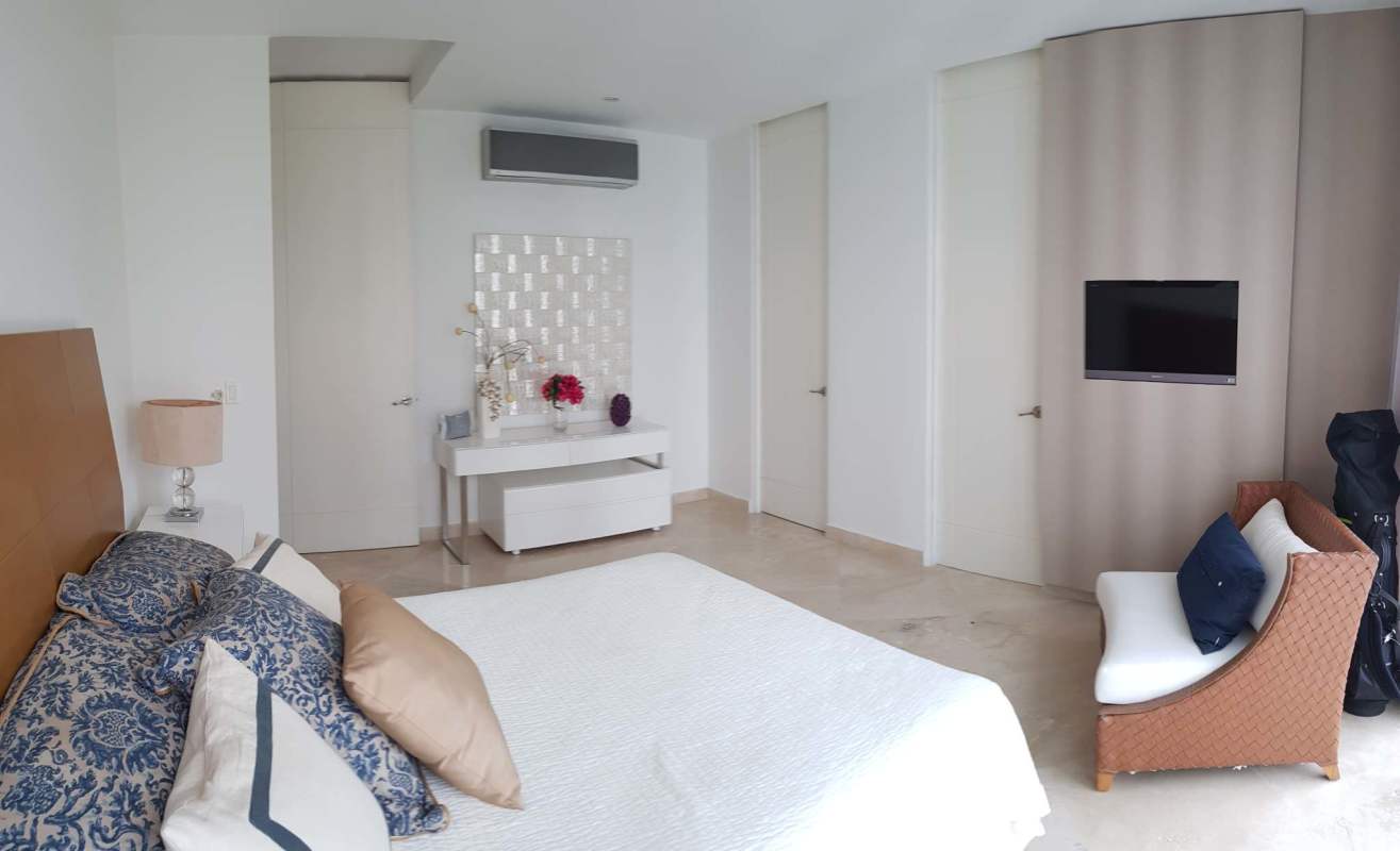 Modern bathroom with glass-enclosed shower and stone vanity in luxury condo Aqualina Punta Pacifica