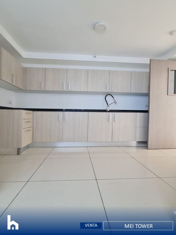 Bright bedroom with ceramic tile floors and large window in MEI Tower apartment Betania Panama