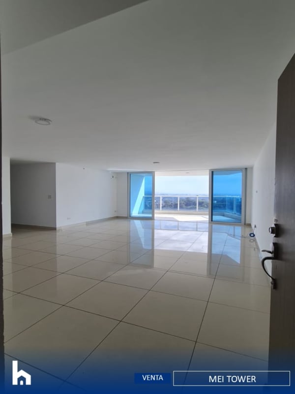 Kitchen with ceramic tile floors, wooden cabinetry and large window in MEI Tower apartment Betania Panama