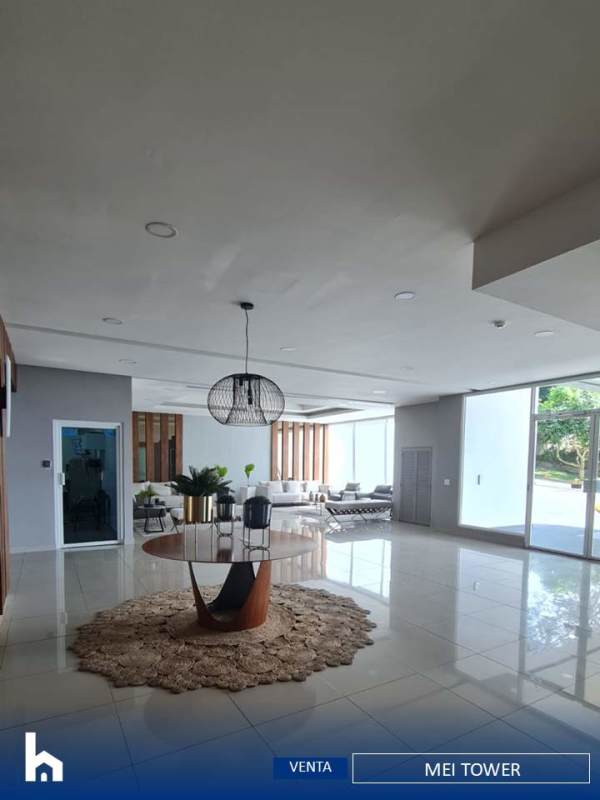 Spacious living room with panoramic windows, tile floors and access to balcony PH MEI Tower Panama City