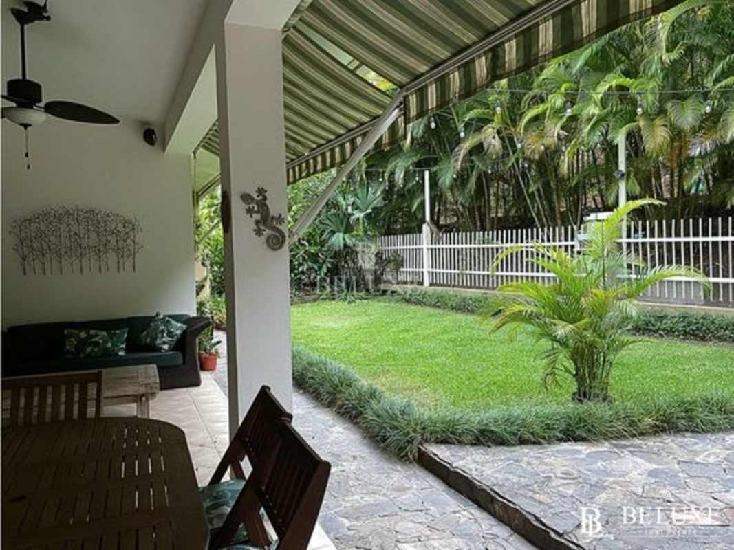 Spacious open-plan living dining with wood divider, large windows, Embassy Gardens Panama