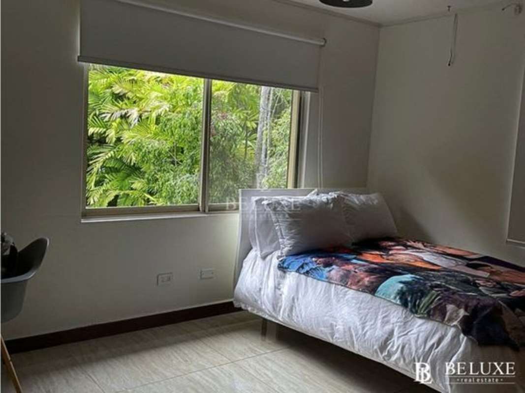 Bedroom with large window, garden view, tile flooring Embassy Gardens Clayton