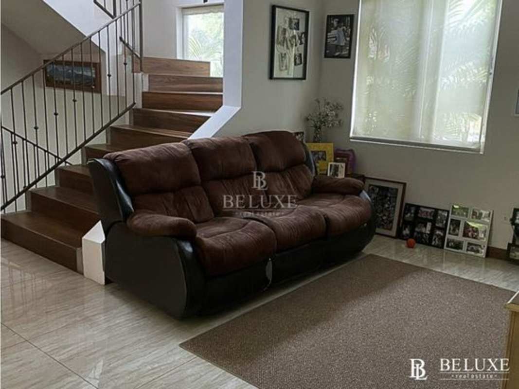 Living room with ample natural light and outdoor access at PH Embassy Gardens Clayton Panama