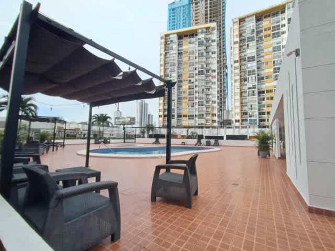 Swimming pool with pergola lounge area in PH Aviñon residential complex Panama