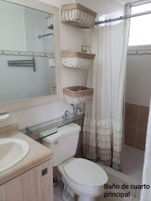 Compact bathroom with shower, mirror and window in PH MC Greggor Panama