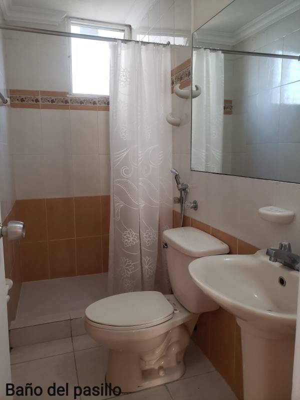 Spacious bedroom with built-in wardrobe, ceiling fan and tiled floor in PH MC Greggor Panama