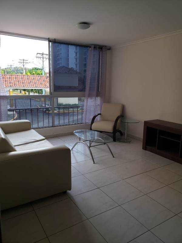 Open layout living and dining room with white tile floors PH McGregor Valley Panama