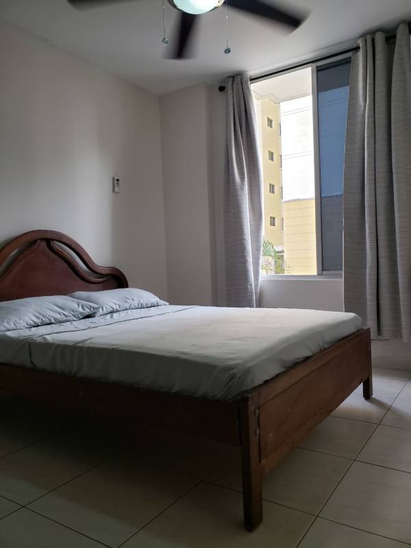 Bedroom with window, curtains and ceiling fan in PH McGregor Valley, Condado del Rey Panama