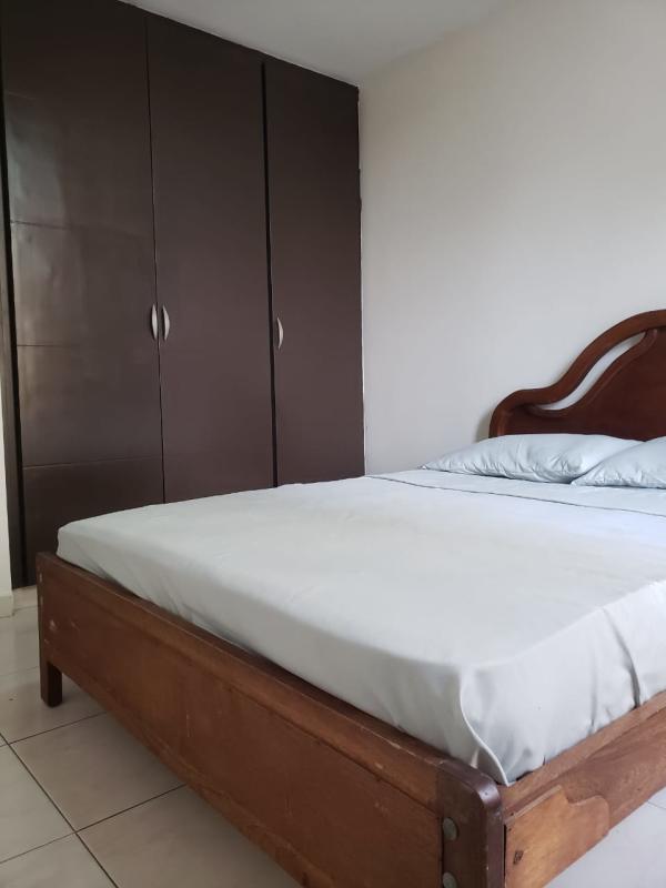 Apartment bedroom with built-in wardrobe, tile floor, minimalist style in PH McGregor Valley Panama