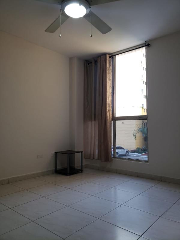 Minimalist bedroom with large window, ceiling fan, tiled floor in PH McGregor Valley Condado del Rey Panama