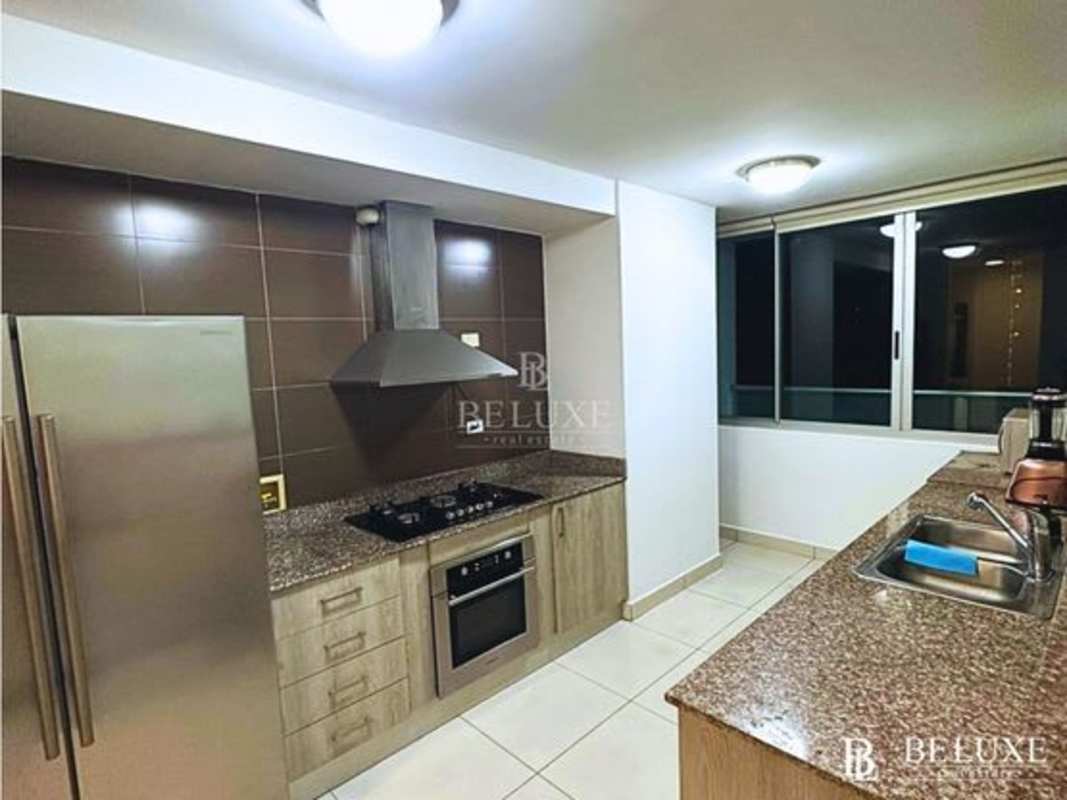 Open kitchen with granite countertops and stainless appliances in PH Moon Tower Coco del Mar Panama
