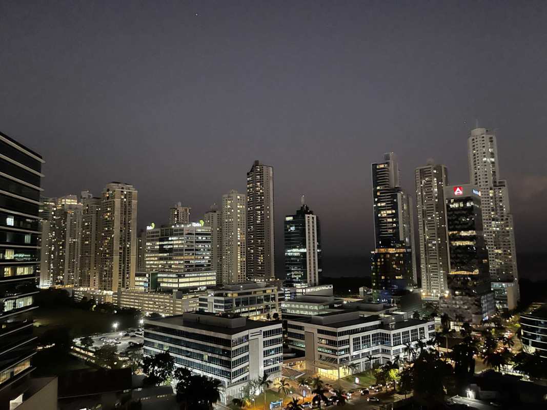 Nighttime city skyline with high-rise buildings in Costa del Este Panama seen from Sevilla Towers