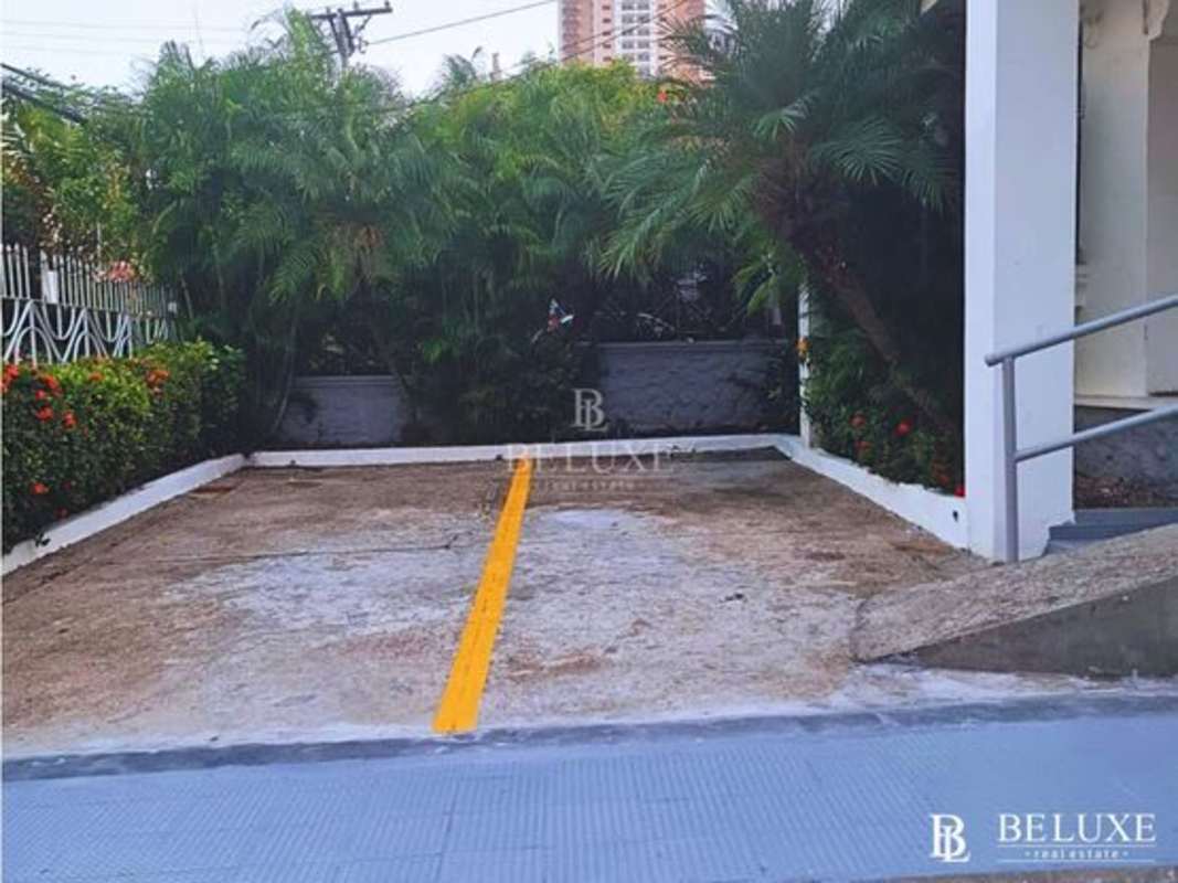 Outdoor parking with accessibility ramp, palm trees and garden landscaping PH El Cangrejo Business Center Panama City