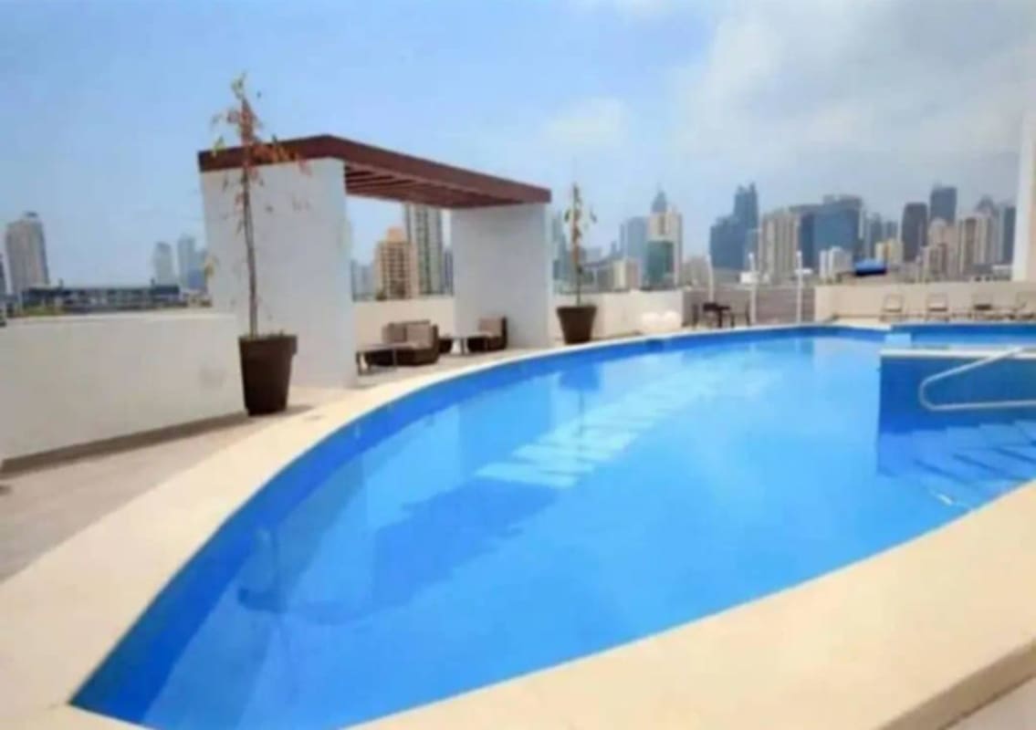 Bedroom with modern wardrobe, floating TV, neutral decor PH Metropolitan Park Panama City