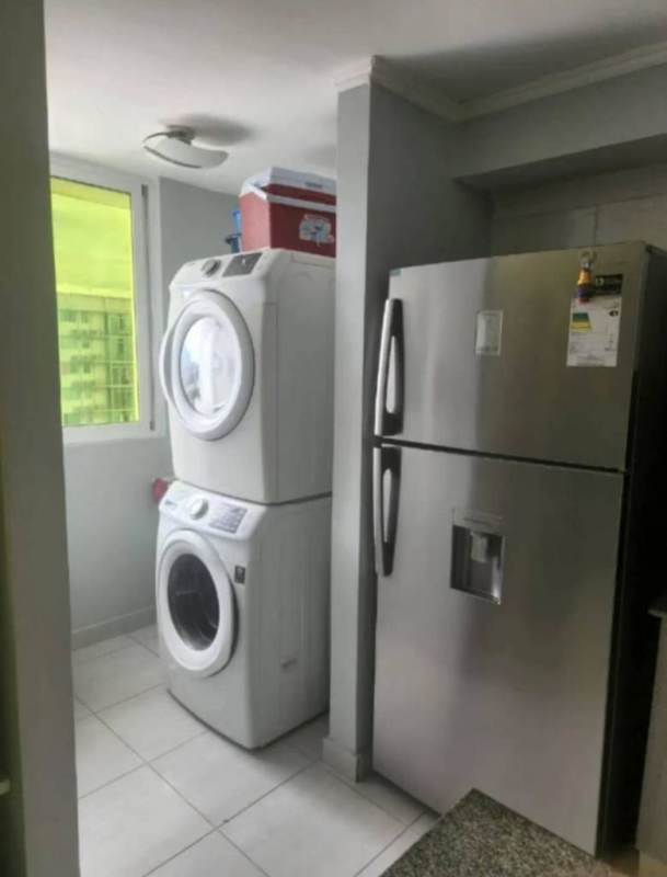 Small office nook with ocean wall art, black desk at PH Metropolitan Park Panama