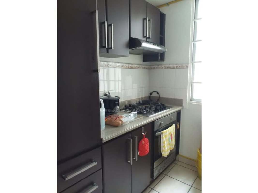 Apartment kitchen with gas stove, granite countertop and storage cabinets PH Plaza Valencia Panama City