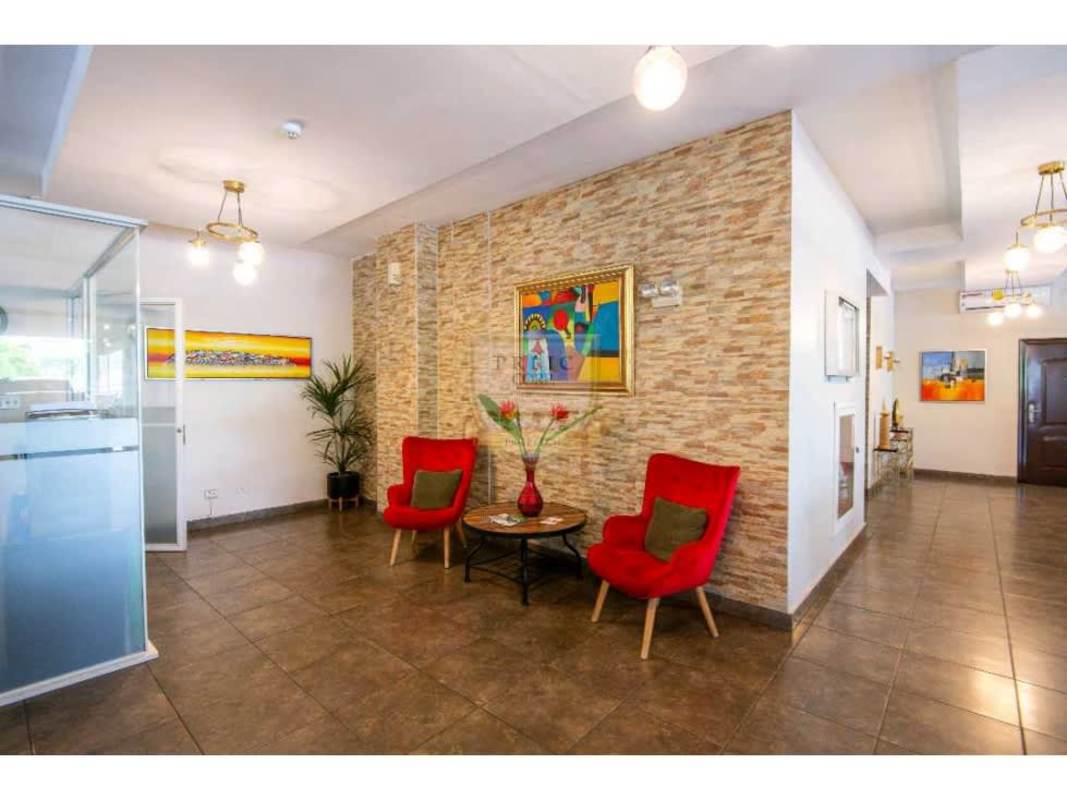 Bright living and dining area with windows and tile floors PH Brisas de San Fernando
