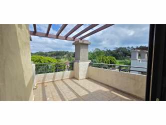 Kitchen with granite countertops, island bar, full appliances in River Valley Panama Pacifico apartment