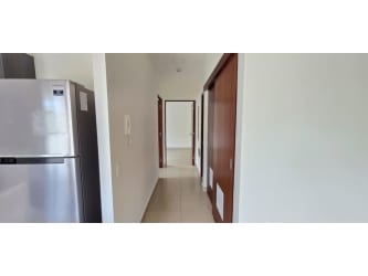 Large covered terrace with views of green gardens at River Valley Panama Pacifico