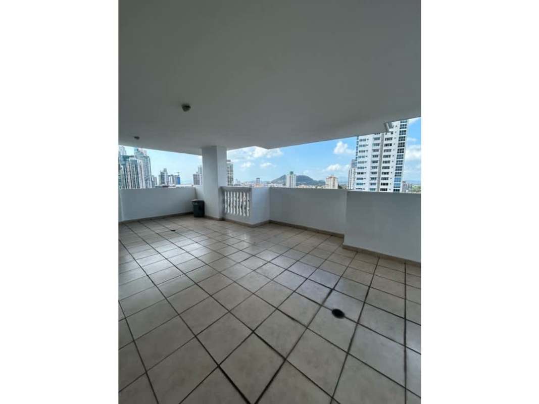Spacious covered balcony overlooking city skyline from apartment at PH Bella Vista Tower Panama City
