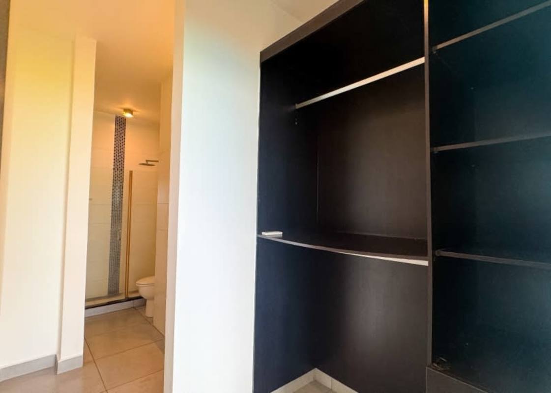 Bright dining area with pendant lights AC open kitchen PH Element Tower Panama City