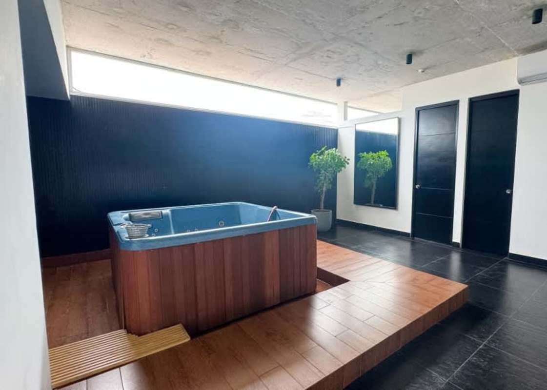 Modern gym equipment windows accent wall PH Element Tower Panama City Panama