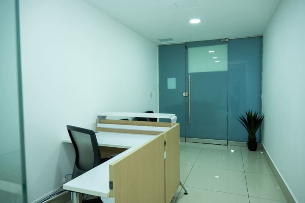 Glass-partitioned private executive office facing ocean in BICSA Tower Panama