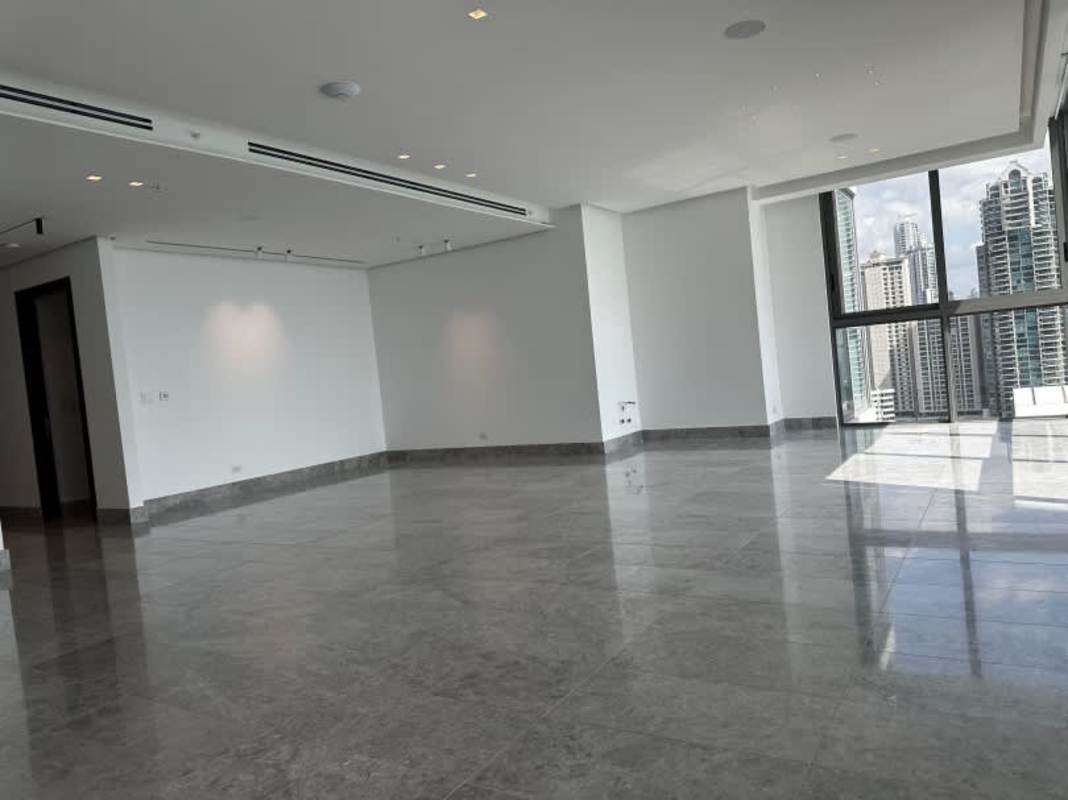 Large open living area with marble flooring and panoramic Pacific Ocean view windows in PH Ocean Front Punta Paitilla