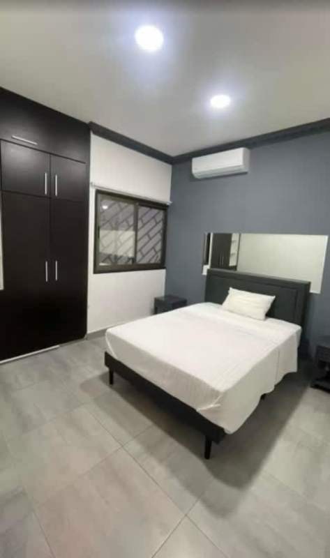 Furnished bedroom with walk-in closet, modern finishes in Altos de Panamá house rental