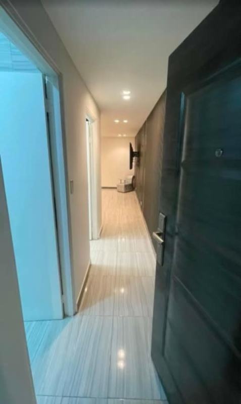 Stylish kitchen with granite countertops, appliances, and island in Altos de Panamá rental house