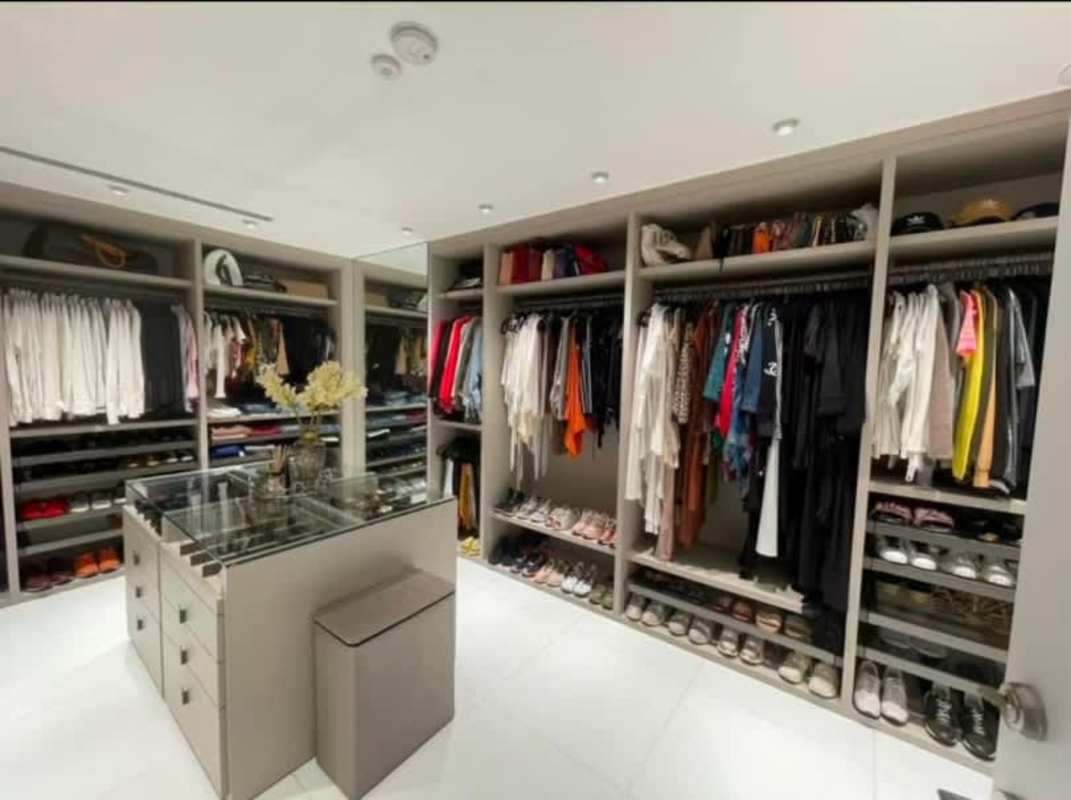 Custom walk-in closet island drawers extensive shelving Ocean Club Punta Pacifica