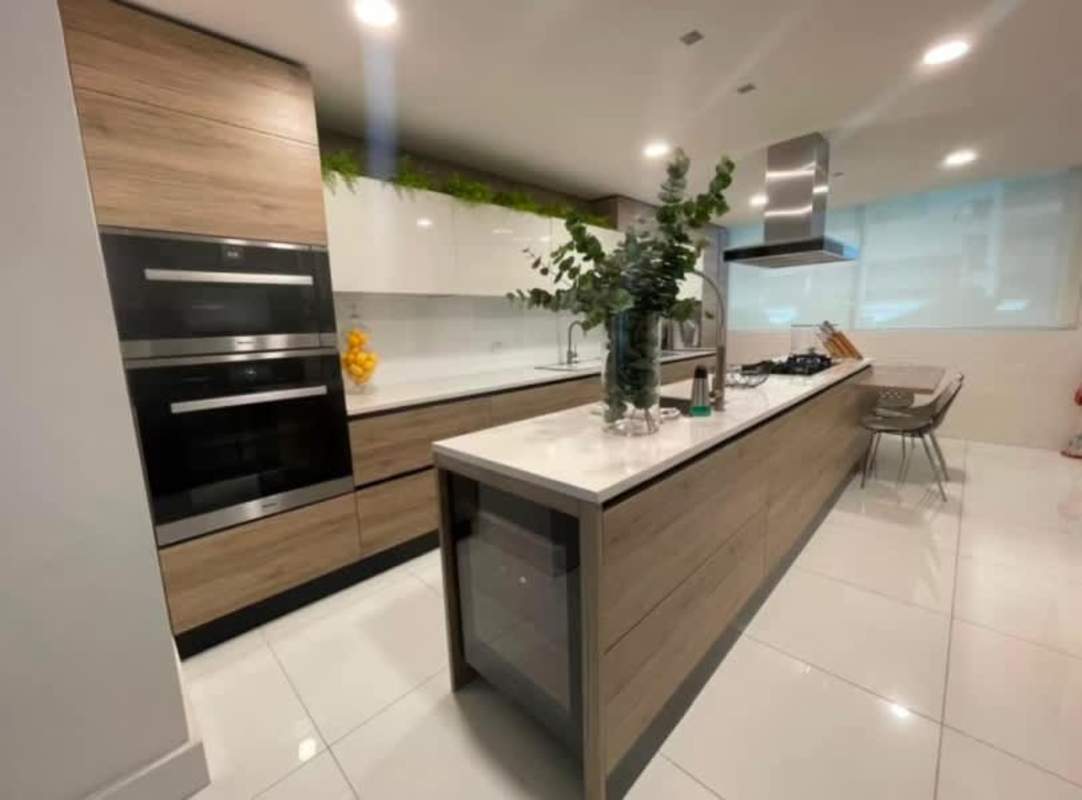 Upscale kitchen island, wall ovens, sleek cabinetry in PH Ocean Club Punta Pacifica Panama