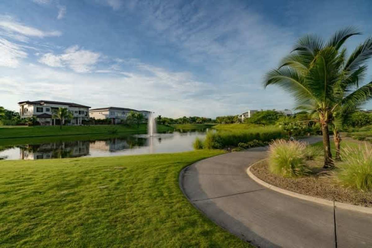 Luxury residential golf community at sunset with skyline in Santa María Panama