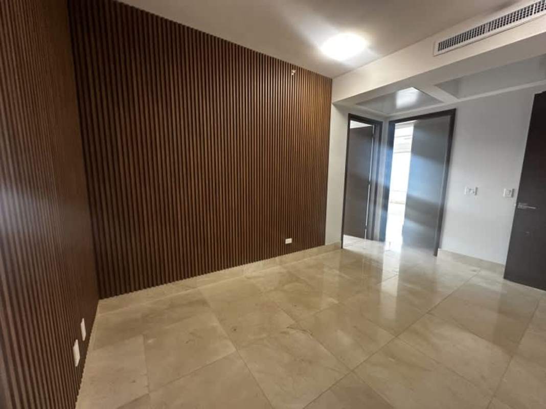 Master bedroom with large windows and golf views in Santa Maria Panama