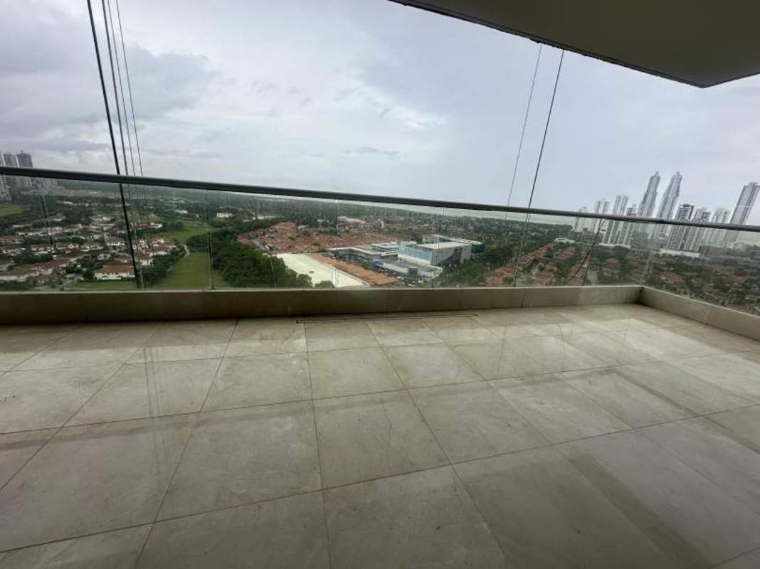 Panoramic balcony with glass railing overlooking golf course and skyline at Santa Maria Panama