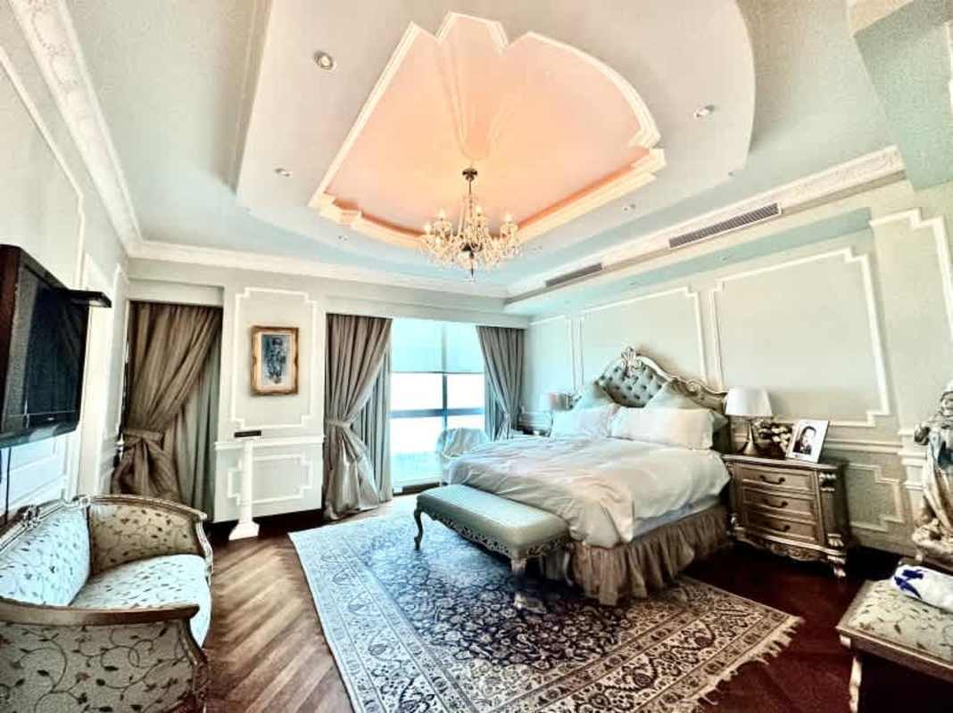 Luxurious master suite bedroom with tray ceiling chandelier PH Titanium Costa del Este
