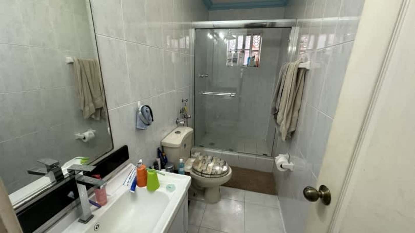 Two-story house exterior facade gated community Condado del Rey Panama Hola Realty