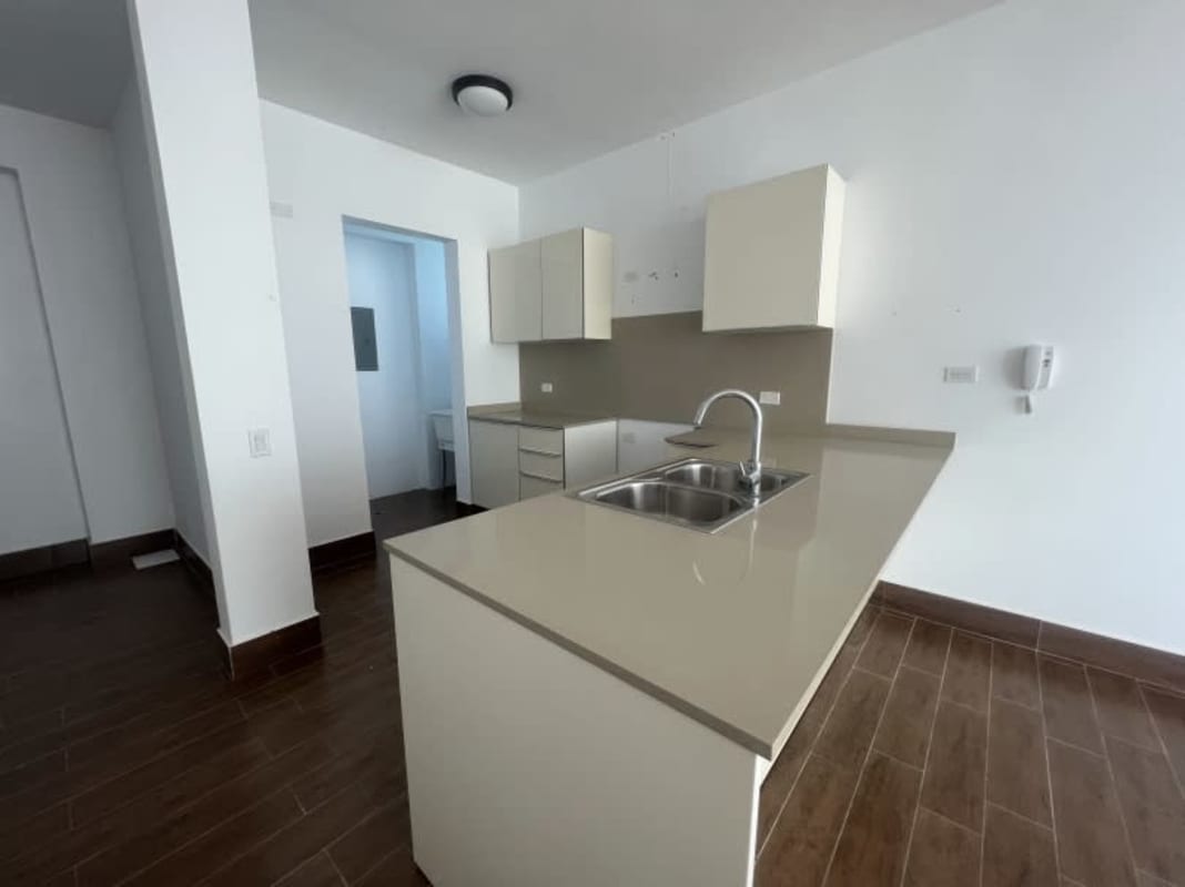 Modern bathroom with glass enclosed shower, vanity sink at PH Costamare