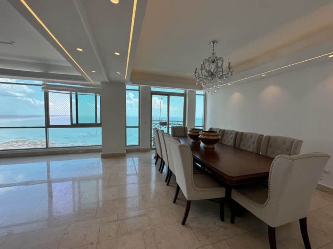 Elegant dining area with oceanfront windows at PH Ocean Club Panama