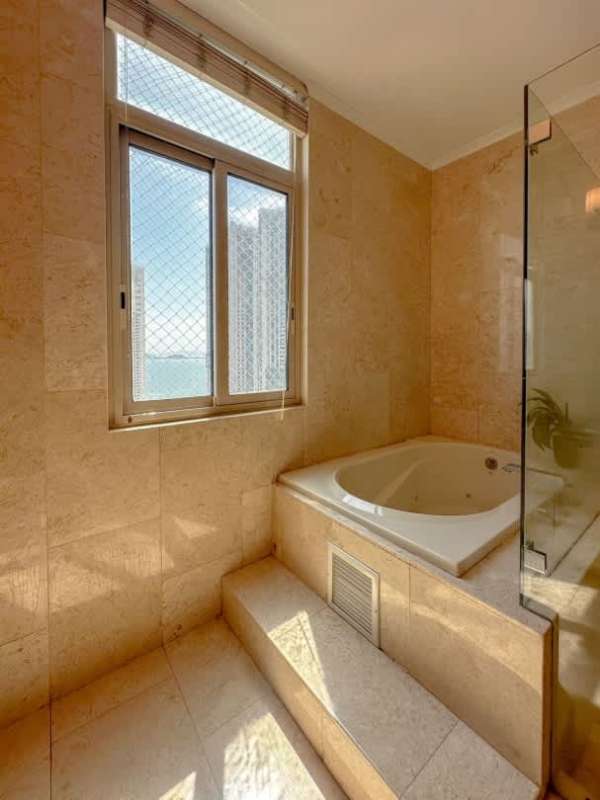 Bathroom with marble tiles, double vanity, glass shower PH Ocean Club Punta Pacifica Panama