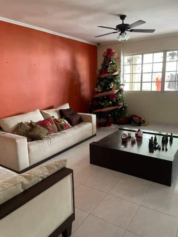 Traditional entrance with chandelier and art in Residencial El Doral Panama City