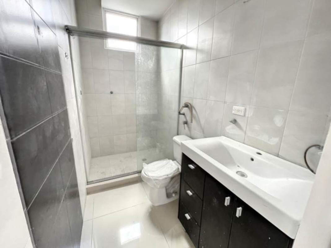 Modern bathroom with glass shower enclosure vanity sink El Cangrejo Panama