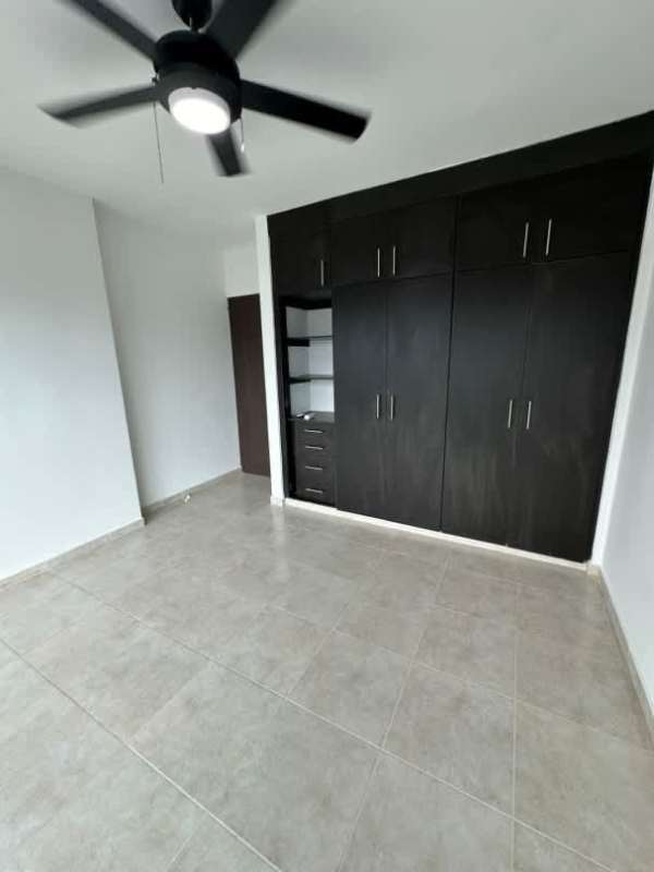 Spacious living room tiled floor large glass windows city view at Park City Panama