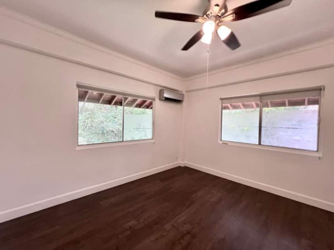 Bedroom with AC, built-in closet, wood floors Clayton family home for rent