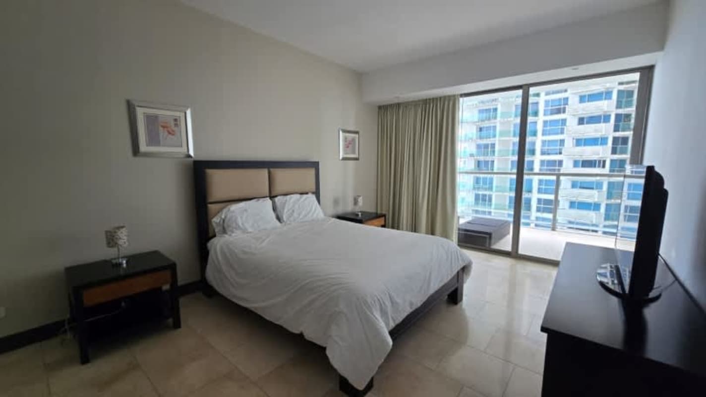 Second bedroom with built-in closet and skyline view at PH Oceanaire Panama